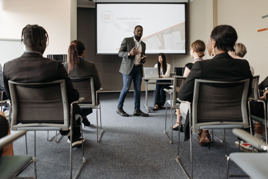Trainer delivering an ISO standards workshop to professionals